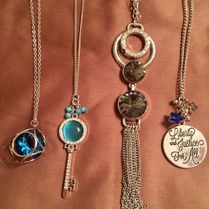 4 Long Silver Necklaces with Pendants.